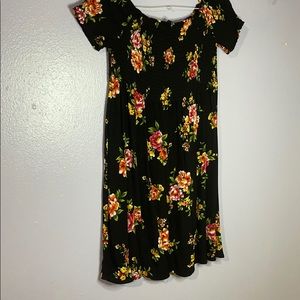 Off the shoulder shirt sleeve dress .